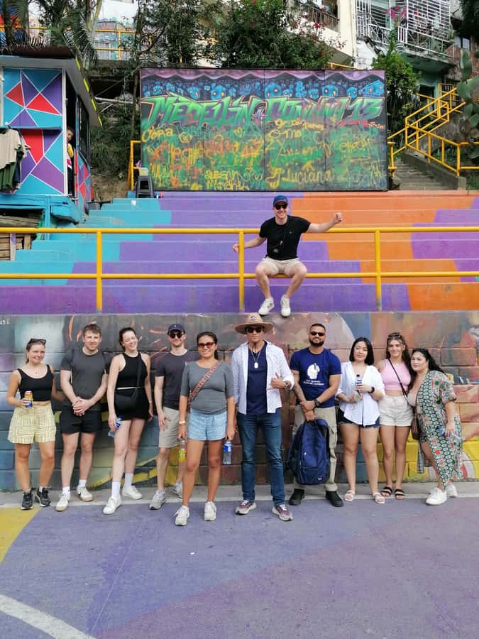 Comuna 13: Graffiti tour & Street Food/drink with telesferic - Walking through graffiti, escalators, and local stories