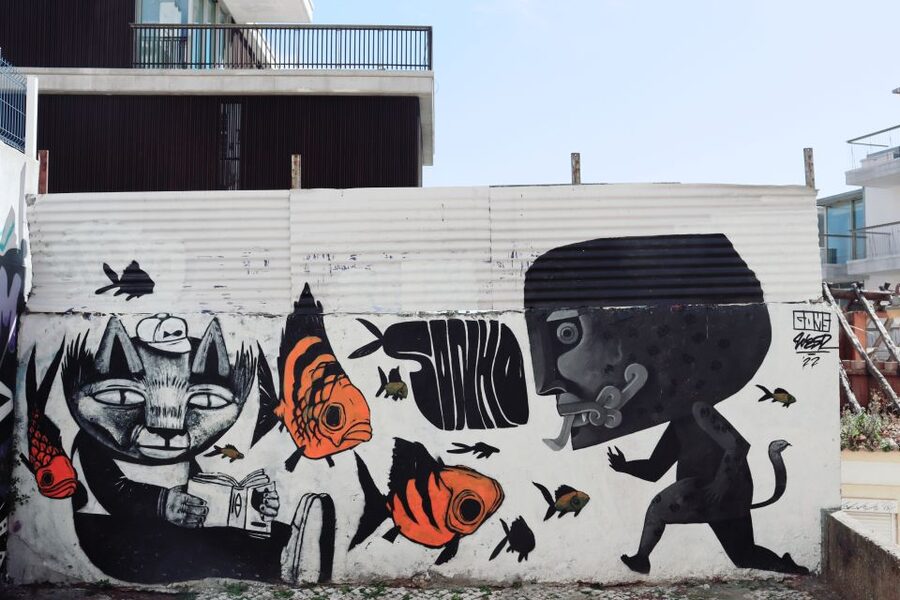 Lisbon: Street Art and Historical Walking Tour - The downhill route, footwear, and effort