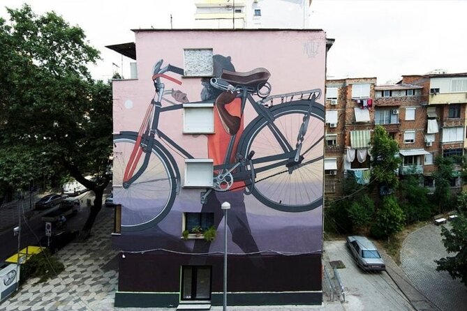 Tirana Mural Bike Tour: Street Art, Culture & Photography Stops - Starting among Tirana’s market streets