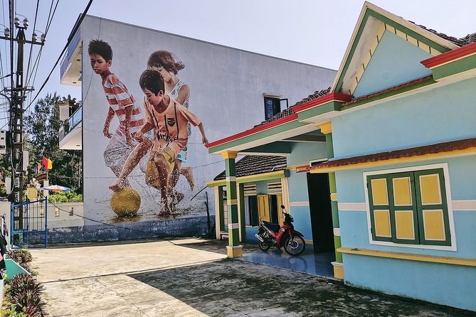 Visiting Tam Thanh mural village - Mother Thu monument - Stop two: Tam Thanh’s painted house walls
